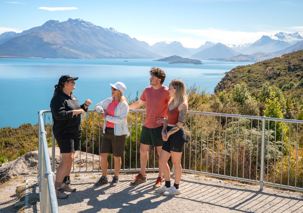 Guide talking with guests at the Bennetts Bluff lookout above Lake Wakatipu