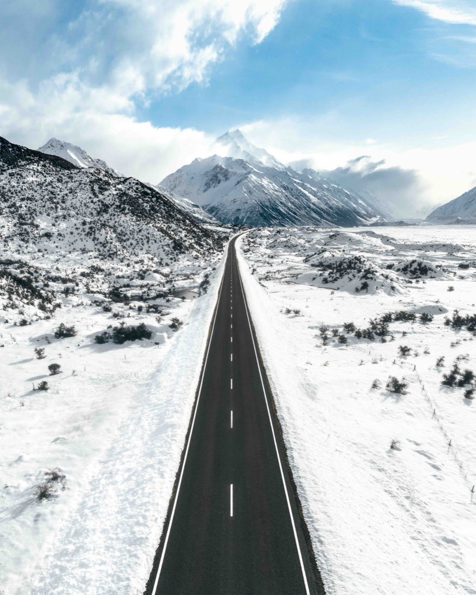 Snow-covered road leading towards Aoraki Mount Cook